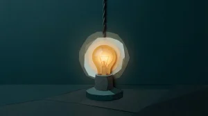 Glühbirne in einem Keramiksockel mit warmem Lichtschein